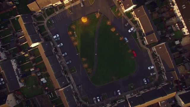 4k Aerial above Houses and Child Looking in Map, zoom in normal speed