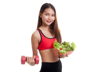 Beautiful Asian healthy girl with dumbbell and salad.