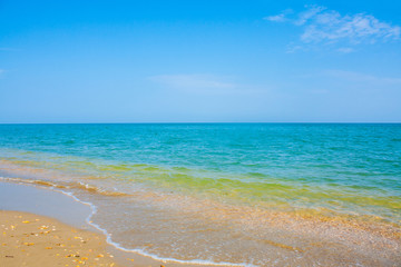 Adriatic Sea coast view. Seashore of Italy, summer sandy beach with clouds on horizon.