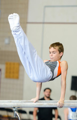 Fototapeta premium Gymnast on paralel bars