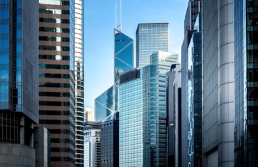 Papier Peint photo autocollant construction de la ville Commercial buildings stretch up to the sky in Hong Kong