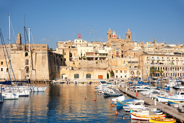 Sailing boats on Senglea marina in Grand Bay, Valetta, Malta
