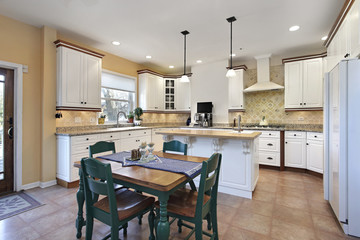 Kitchen with green chairs