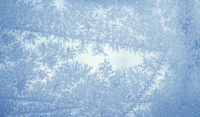 frost crystal on window glass in winter season