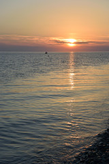 Fototapeta na wymiar Sunset over the sea in the Bay of Imereti