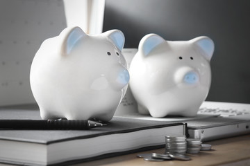 Pig piggy bank, coins, bank book, notebook, desktop concept of saving money.