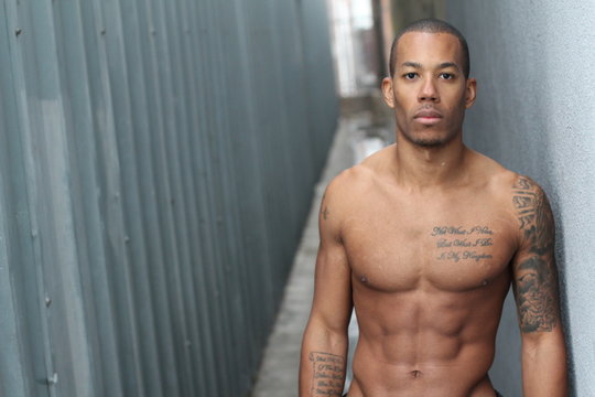 Sensuous African American man shirtless with copy space
