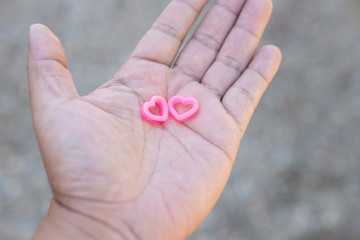 Couple hearts on hand.