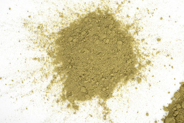 green powder heap isolated on white background