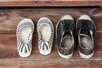 old shoes of  women  and  man  on a wooden deck