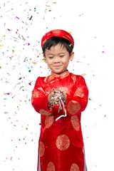 Happy Vietnamese boy in red Ao Dai celebrating New Year with con with con