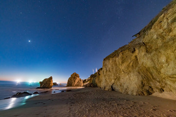 Night skies and stars over the cliffs at El Matador state Beach near Malibu California