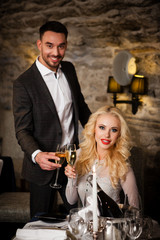 Couple celebrating in restaurant