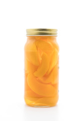 peach in bottle on white