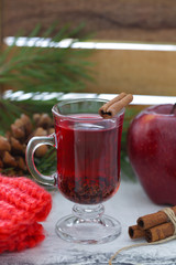 Hot christmas mulled wine with apple, cinnamon and raisins Winter drink