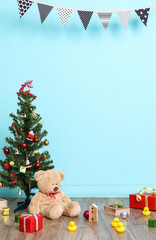 Christmas tree, flag and Christmas decorations with toy teddy be