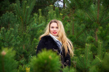 Naklejka premium Woman posing in pines