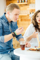 Man eating snack at table