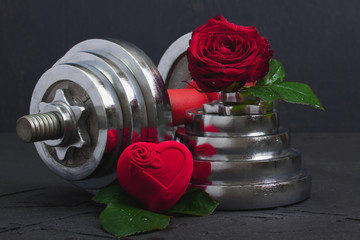 Valentines sports background with dumbbell, rose and heart box.