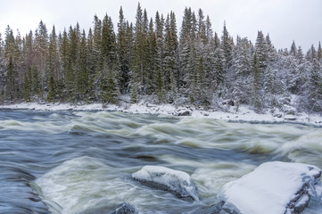 Tannoforsen waterfall in Sweden in winter