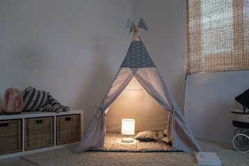room in the house with the tepee