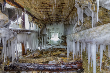 many beauty icicles under the old abandoned bridge