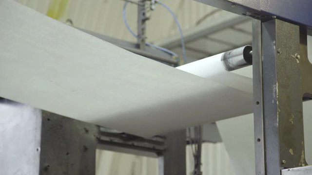 Scrolling of paper on press, close up