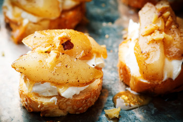 pears and rocotta crostini.selective focus