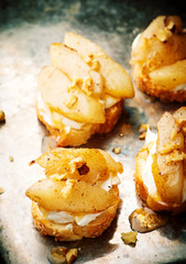 pears and rocotta crostini.selective focus