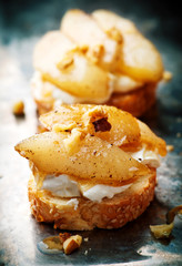 pears and rocotta crostini.selective focus