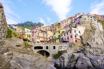 Fototapeta na wymiar Manarola town, Riomaggiore, La Spezia, Liguria, northern Italy. The colourful houses on hills, the sea, balconies and windows. Part of the Cinque Terre National Park and a UNESCO World Heritage Site.