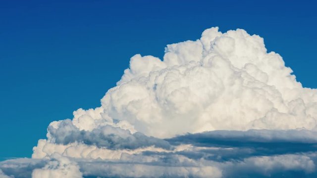 Cumulus clouds forming on a blue summer day