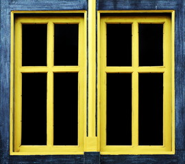 Yellow/Gold wood window in dark blue frame.