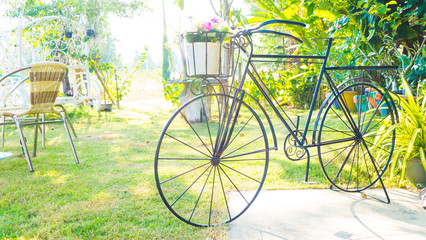 Vintage bicycle with flower in garden - vintage effect filter st