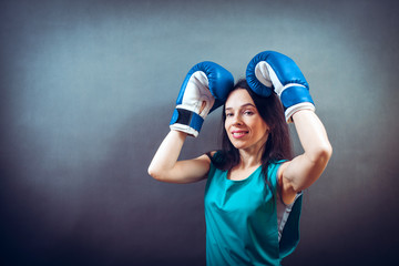 Boxer woman during boxing exercise making direct hit