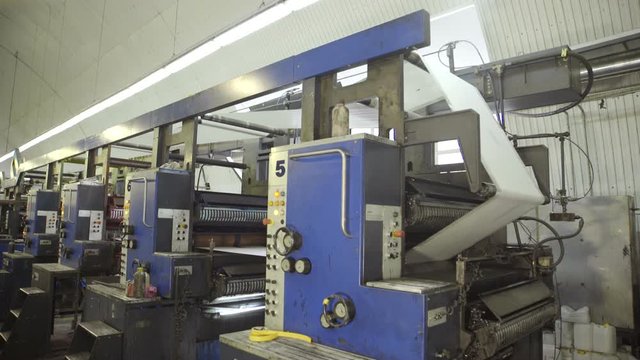 cleaning rollers on machines in plant before printing.