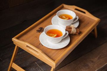 Herb tea with spice and lemon for two person. Selective focus