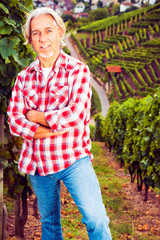Winemaker Standing By His Vineyard