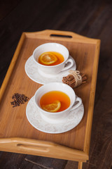 Herb tea with spice and lemon for two person. Selective focus
