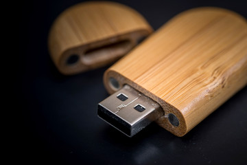 wooden usb isolated on black background