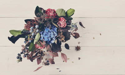 Beautiful bouquet floral composition of dried meadow flowers and leaves