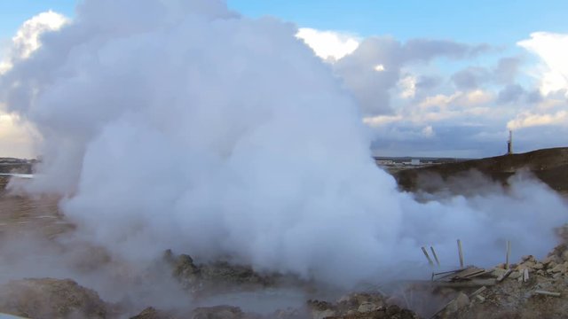 huge white puffs of steam are pulling out from earth and crashed bridge are on first plan
