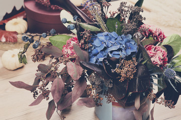 Beautiful autumn bouquet composition of dried meadow flowers and leaves