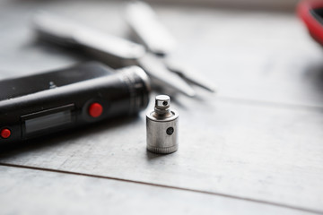 Rebuild vaping device gadget for vaper