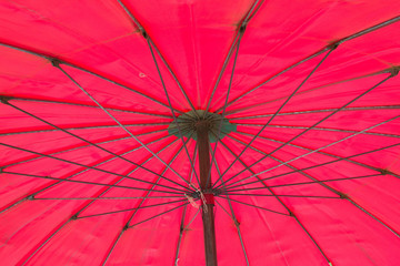 Red big umbrella inside background