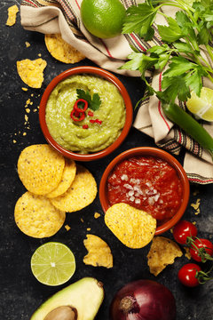 Green Homemade Guacamole with Tortilla Chips and Salsa