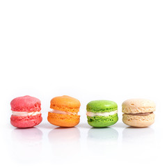 Colorful macaroons isolated on white with space for text. Traditional french dessert.