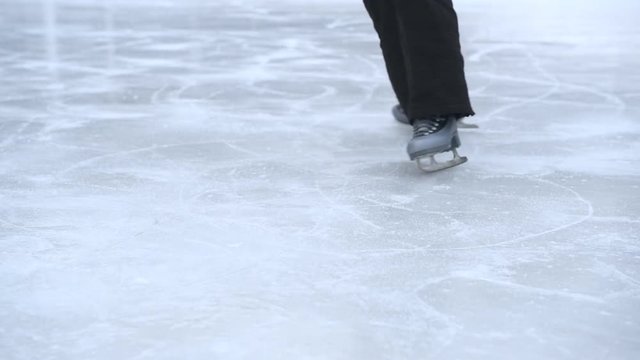 Girl skating on ice in the winter.
