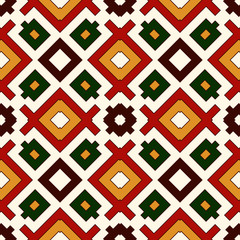 Seamless pattern in Christmas traditional colors. Repeated squares and rhombuses bright ornamental abstract background.