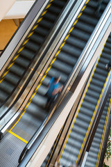 escalator with person movemont in blur from high Angle view